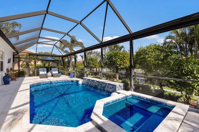 view of swimming pool featuring an in ground hot tub, a patio area, and glass enclosure