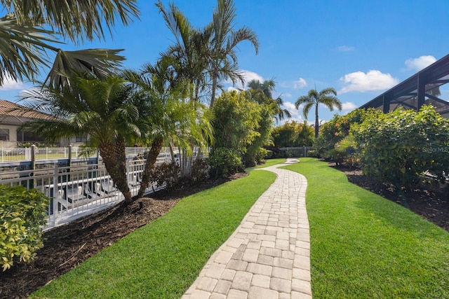 view of home's community featuring a lawn