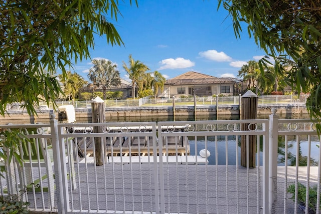 view of gate with a water view