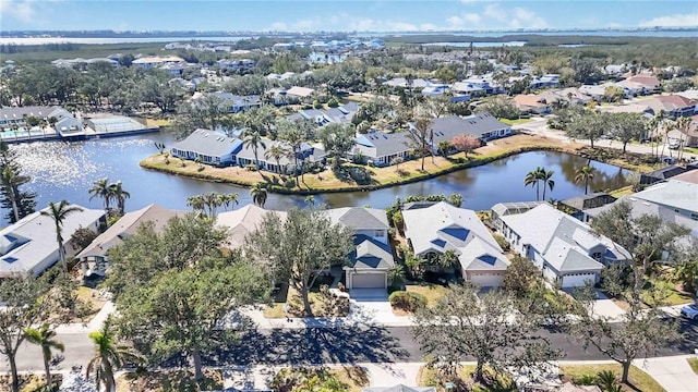 bird's eye view featuring a residential view and a water view