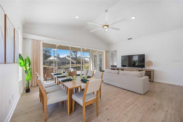 dining space with french doors, ceiling fan, lofted ceiling, and light hardwood / wood-style floors