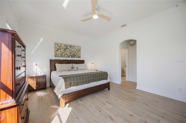 bedroom with ornamental molding, ceiling fan, and light hardwood / wood-style flooring