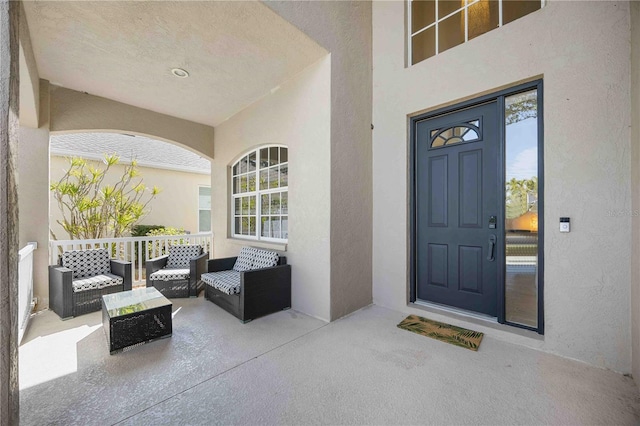 view of exterior entry featuring stucco siding