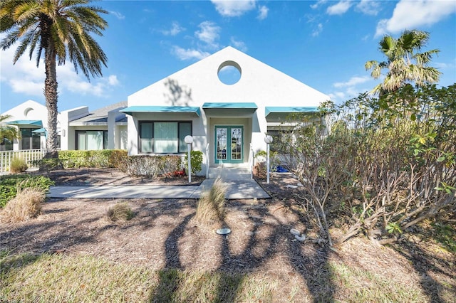 view of front of property with french doors and stucco siding