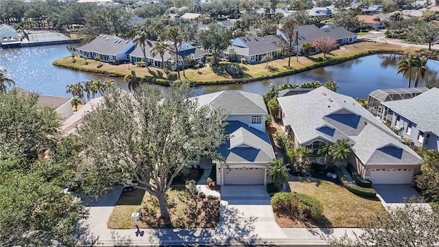 aerial view with a residential view and a water view