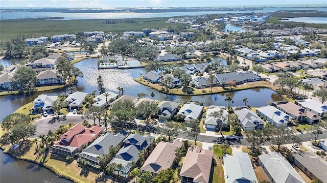 aerial view featuring a residential view and a water view