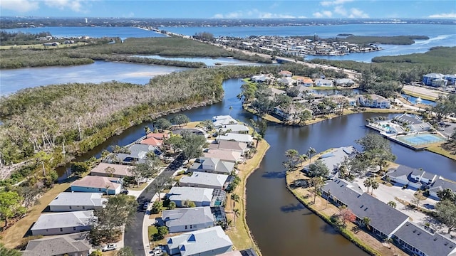 drone / aerial view featuring a water view and a residential view