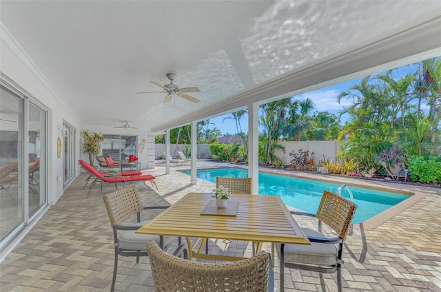 view of pool featuring a patio and ceiling fan