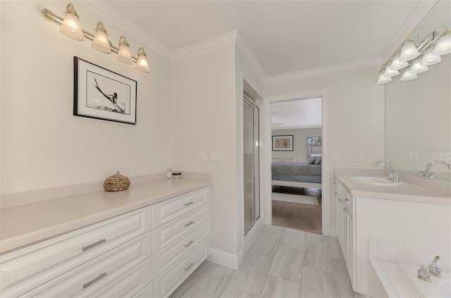 bathroom featuring ornamental molding, vanity, and an enclosed shower