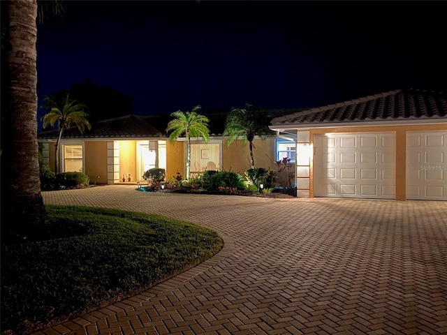 ranch-style house featuring a garage