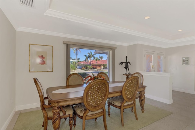 tiled dining room with ornamental molding