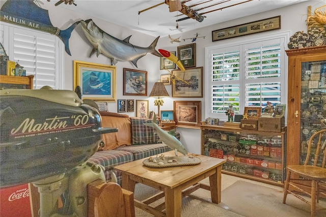 living area featuring ceiling fan