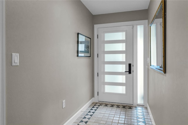 entryway featuring baseboards