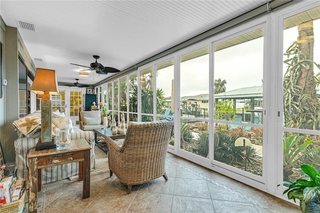 sunroom / solarium with ceiling fan and visible vents