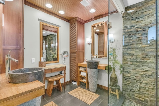 bathroom featuring ornamental molding, tile patterned flooring, a tile shower, and wooden ceiling