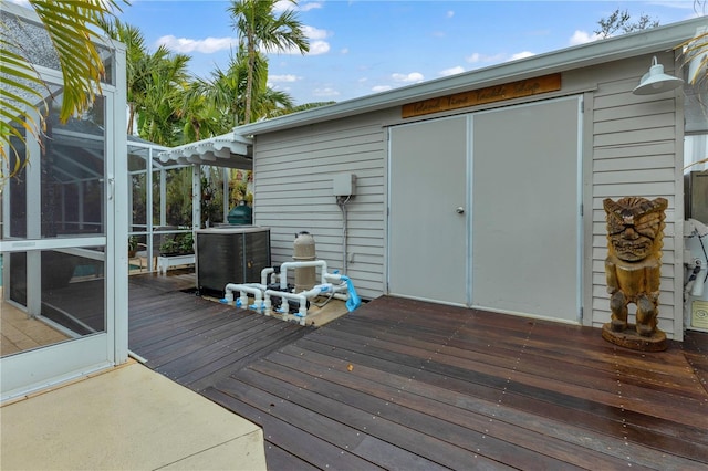 wooden terrace featuring a lanai