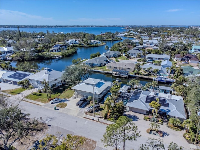 bird's eye view featuring a residential view and a water view