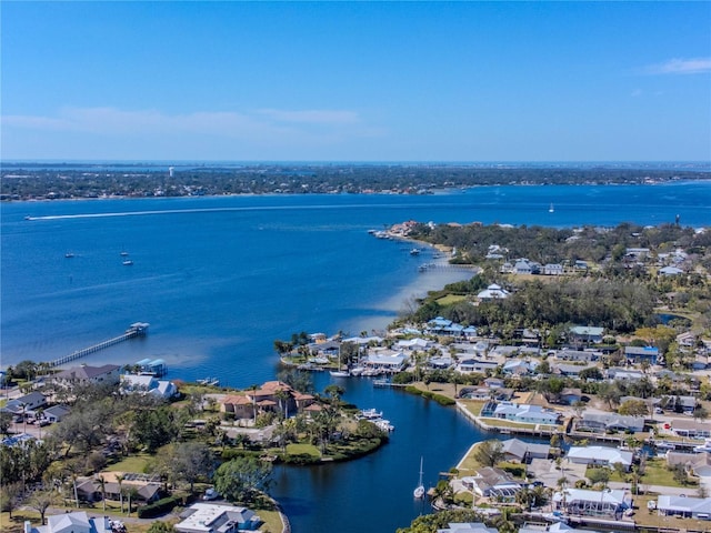 drone / aerial view featuring a water view and a residential view