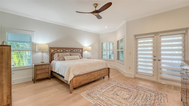 bedroom featuring french doors, crown molding, light hardwood / wood-style flooring, ceiling fan, and access to exterior