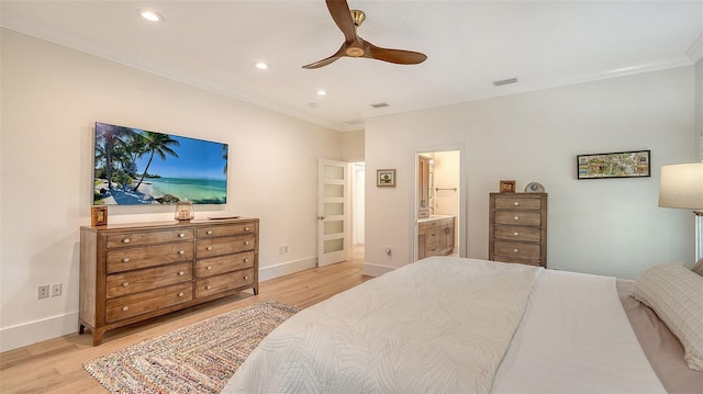 bedroom featuring crown molding, light wood-type flooring, ceiling fan, and ensuite bathroom