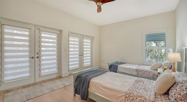 bedroom featuring french doors, access to exterior, ceiling fan, and light hardwood / wood-style floors