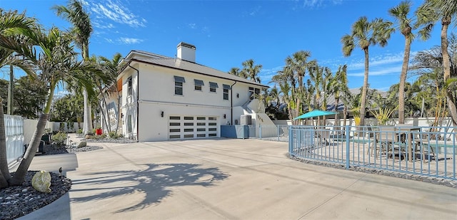 view of side of property featuring a garage