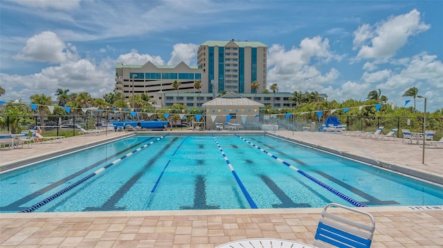 view of swimming pool with a patio area