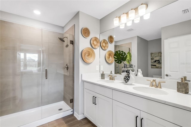 bathroom with vanity and an enclosed shower