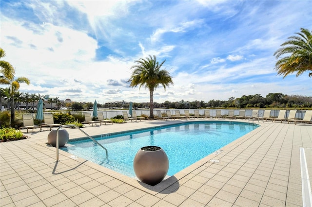 view of swimming pool featuring a patio area