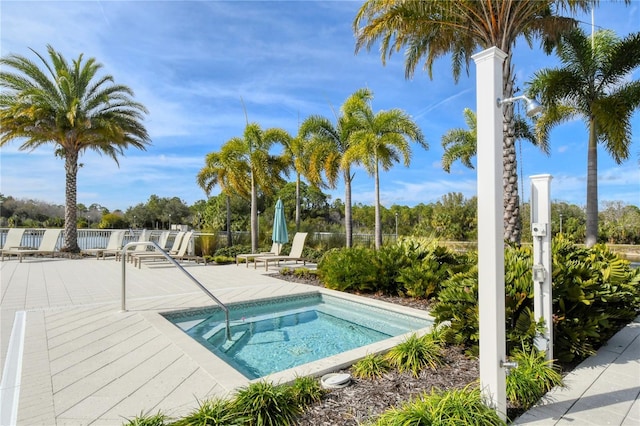 view of swimming pool with a patio area