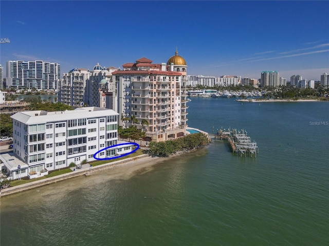 birds eye view of property featuring a water view