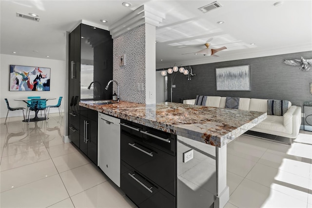 kitchen featuring sink, ceiling fan, dishwasher, light tile patterned flooring, and breakfast area