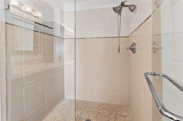 bathroom with a shower with door