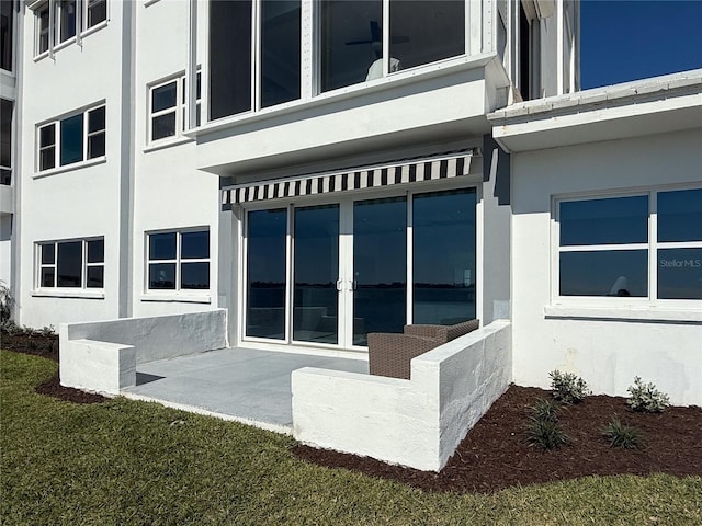 view of side of home featuring a yard