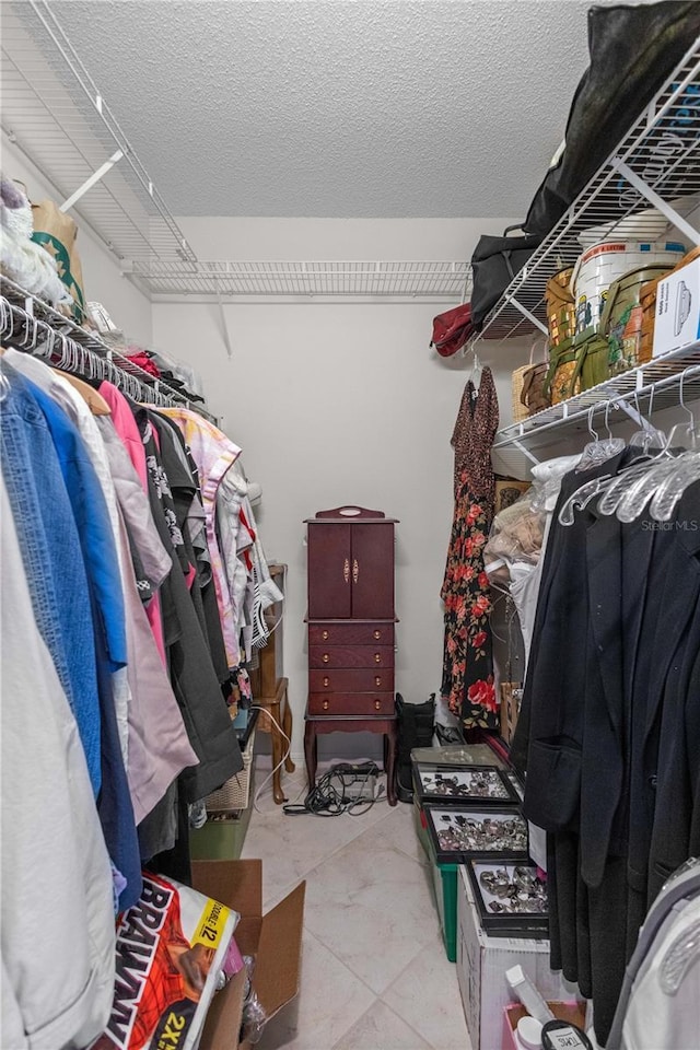 walk in closet featuring light tile patterned floors