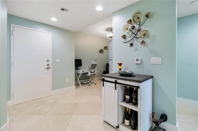 entrance foyer featuring recessed lighting, visible vents, and baseboards