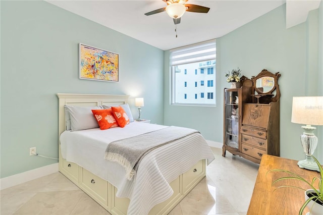 bedroom with light tile patterned floors and ceiling fan