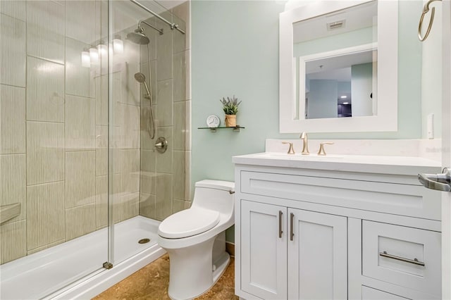 bathroom with vanity, an enclosed shower, and toilet