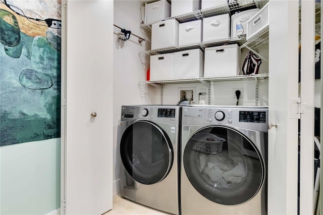 laundry room with independent washer and dryer