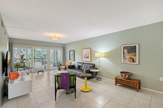 tiled living room with a textured ceiling