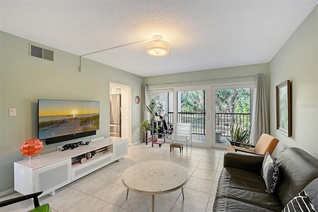 tiled living room with a textured ceiling