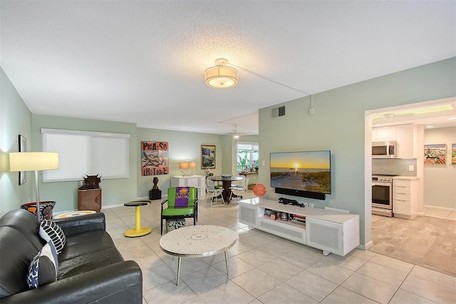 tiled living room with a textured ceiling