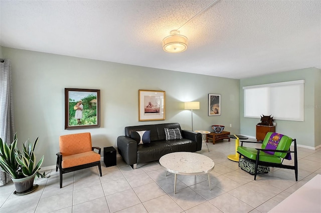 tiled living room featuring a textured ceiling