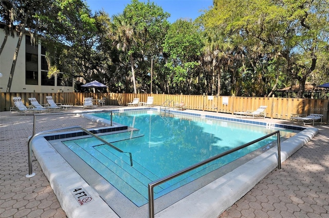 view of swimming pool featuring a patio