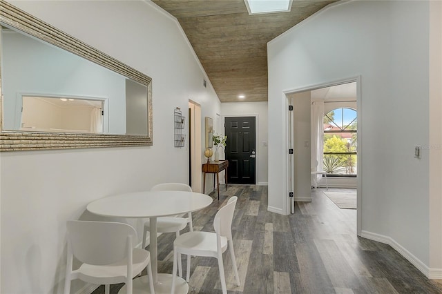 corridor featuring wood ceiling, lofted ceiling, and wood-type flooring