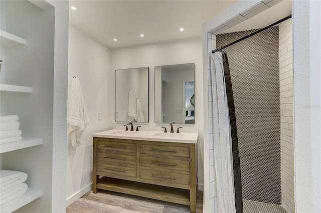 bathroom featuring hardwood / wood-style flooring, vanity, and a shower with shower curtain