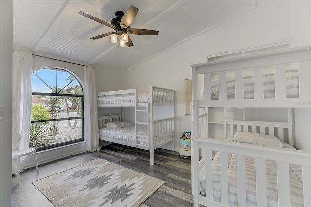 bedroom featuring dark wood-type flooring, ceiling fan, and lofted ceiling