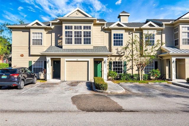 townhome / multi-family property featuring a garage