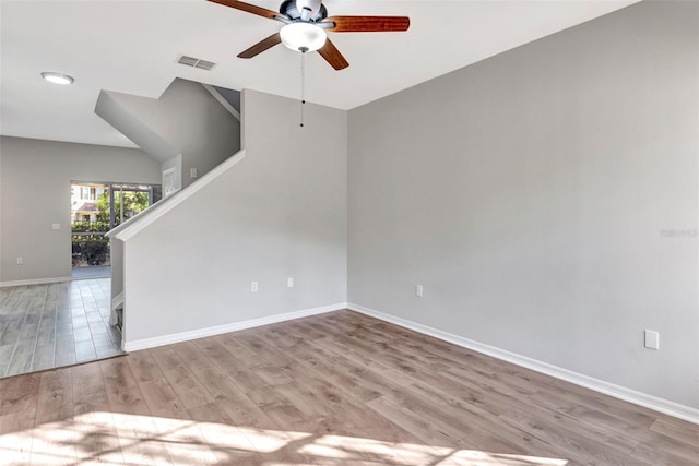 unfurnished living room featuring ceiling fan and light wood-type flooring