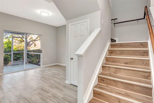 staircase featuring hardwood / wood-style floors